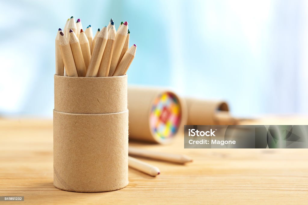 Colored pencils in pencil case Colored pencils in pencil case on wooden table, selective focus Art Stock Photo