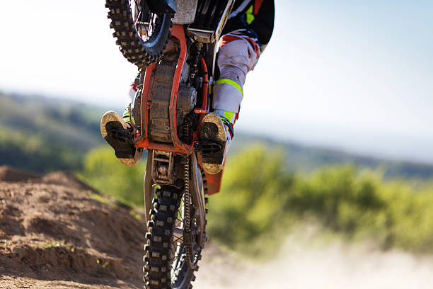 istock Unrecognizable motocross rider practicing on a dirt road. 541851582