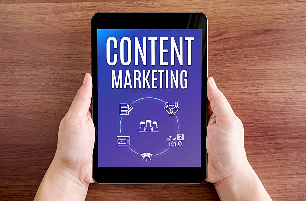 istock Two hand holding tablet with Content marketing and icon 541851718