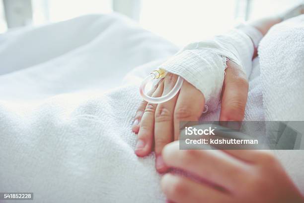 Saline Intravenous Drip In A Childs Patient Hand Vintage Stock Photo - Download Image Now