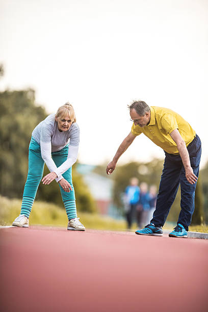 istock Old people doing relaxation exercises after sports training. 541853516