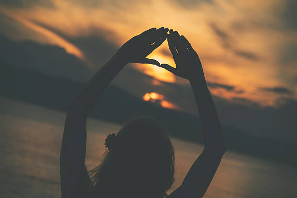istock Woman practicing yoga on the beach. 541860634