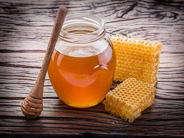 istock Jar full of fresh honey and honeycombs. 541861956