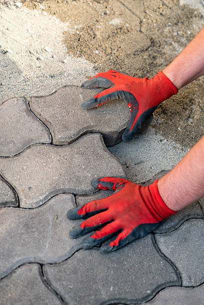 istock The worker positioning the bricks on the patio 541862234