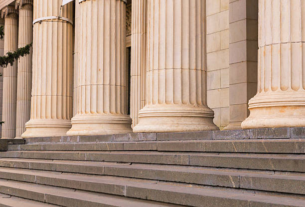 istock Many old greek columns in a row 541862380