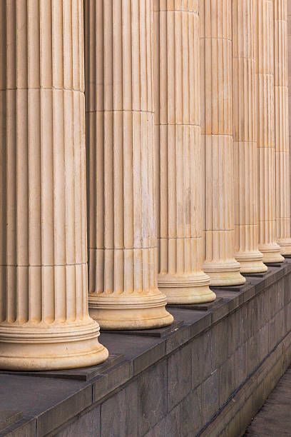 istock Many old greek columns in a row 541862544