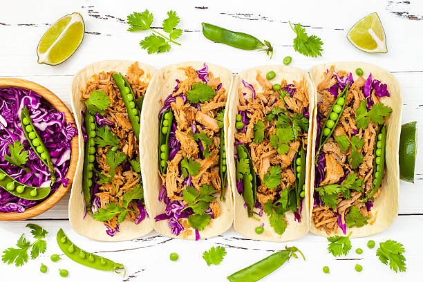 Mexican tacos with meat, peas and purple cabbage Mexican tacos with meat, peas and purple cabbage delaware chicken stock pictures, royalty-free photos & images