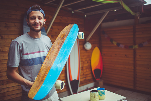 Portrait of skateboard shop owner