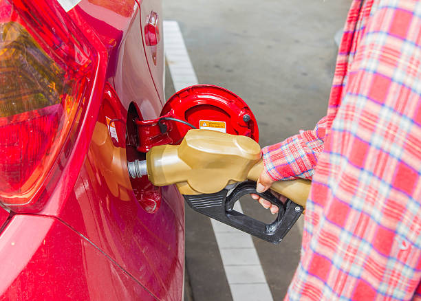 istock Man fills up car with a gasoline 541862948
