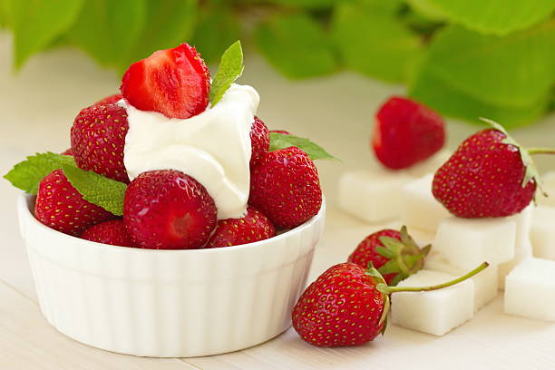 istock Fresh red strawberries with cream 541863408