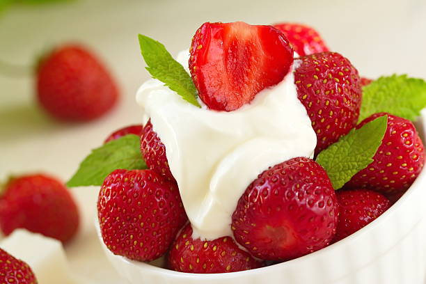 istock Fresh red strawberries with cream 541863576