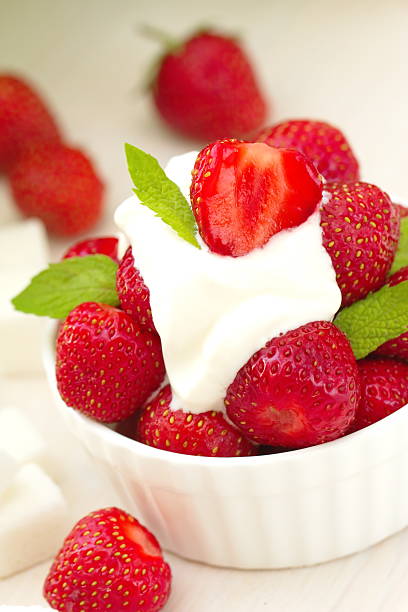 istock Fresh red strawberries with cream 541863662