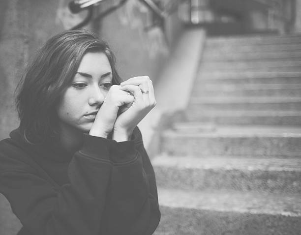 istock Depressed teenager with blank expression 541864796