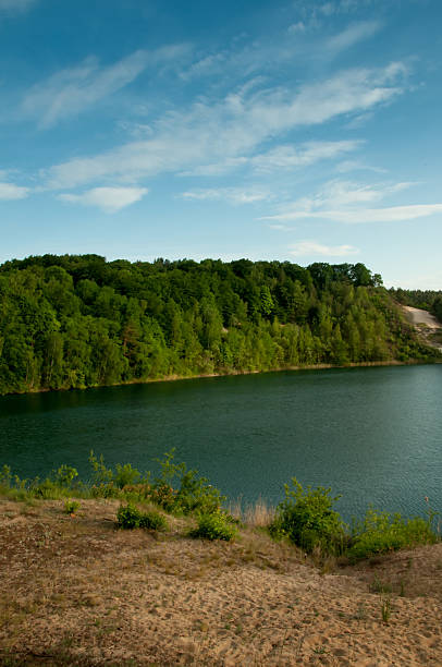 istock Lake with crystal clear water and green forest. 541869884