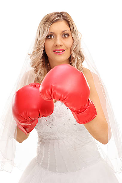 istock Cheerful bride with red boxing gloves 541970610