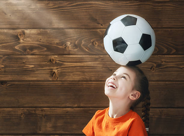istock Child plays football. 541971522
