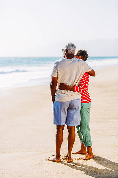 istock Senior African American couple embracing on beach 541972984