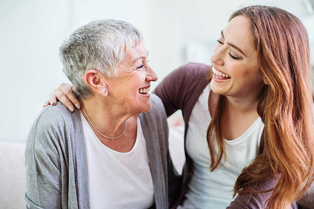 istock Mother and dauther laughing together 541974122