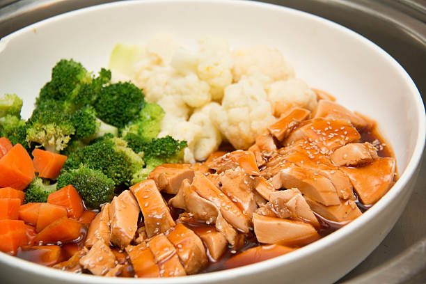 istock roast chicken with gravy, roasted vegetables 541974420