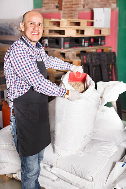 istock Brewery worker holding large bags 541976726