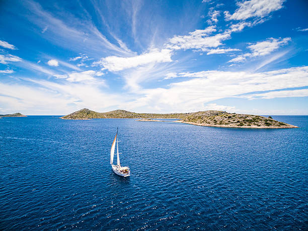 Sailing with sailboat, view from drone Sailboat during sailing. High angle view from drone (quadcopter) Phantom 3. Model released. adriatic sea stock pictures, royalty-free photos & images
