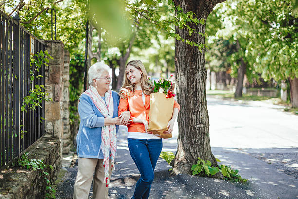 juntos es más fácil - grandmother granddaughter senior adult teenager fotografías e imágenes de stock