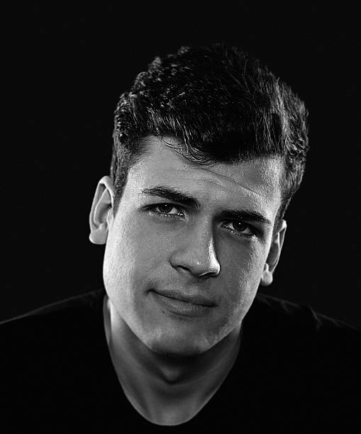 istock stylish bw young man portrait 541978636