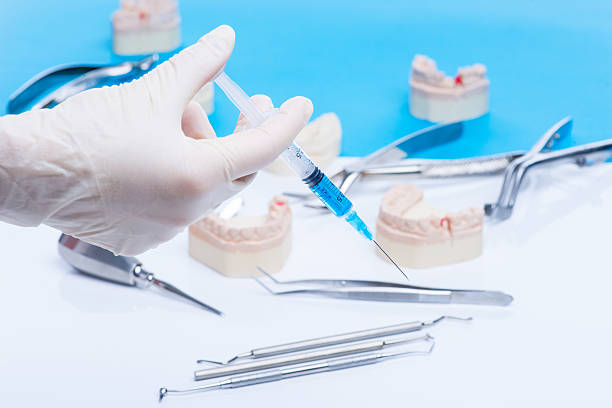 istock Dentist shows how to do the injection 541979948