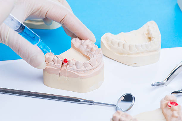 istock Dentist shows how to do the injection 541980288