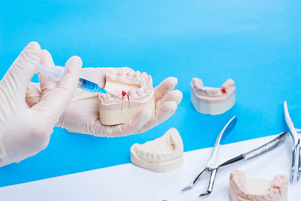 istock Dentist shows how to do the injection 541980526