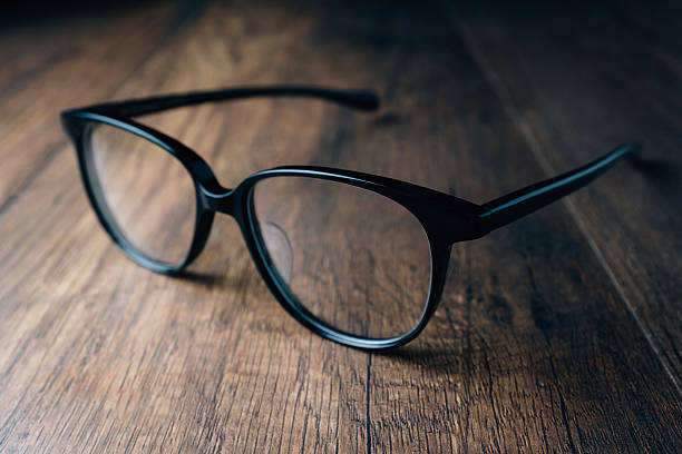 istock Black Vintage Eye Glasses on wooden background 541982102