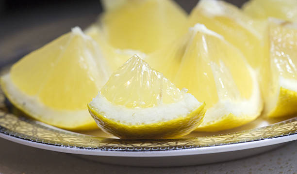 istock close up of fresh lemon slices on a plate 541983188
