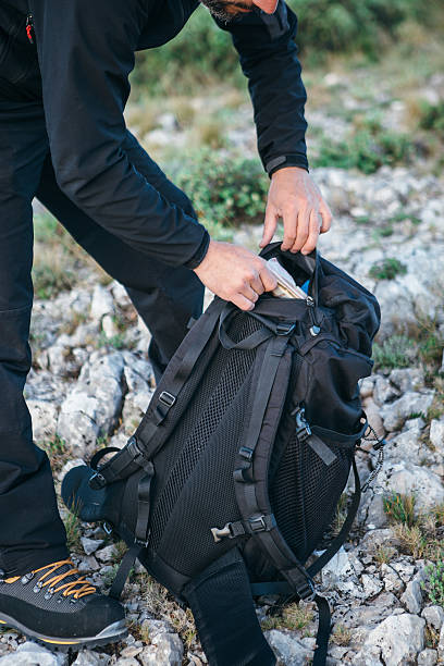istock Adult man with backpack on ground 541983772