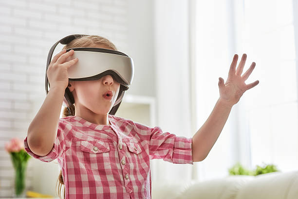 istock girl playing game in virtual reality glasses 541983838