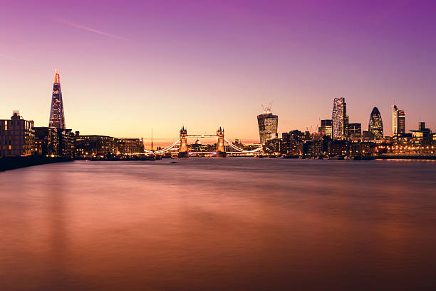 London skyline The Shard Tower Bridge City of London twilight London's skyline with buildings including The Shard, Tower Bridge, St Paul's Cathedral and the corporate landmarks of City of London in a pink twilight. 20 fenchurch street photos stock pictures, royalty-free photos & images