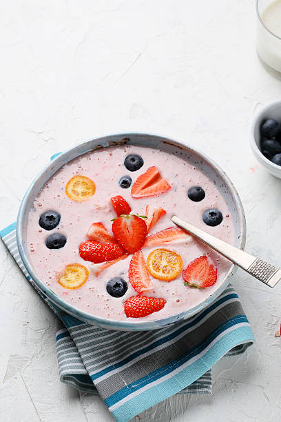 smoothie with strawberries and blueberries in bowl