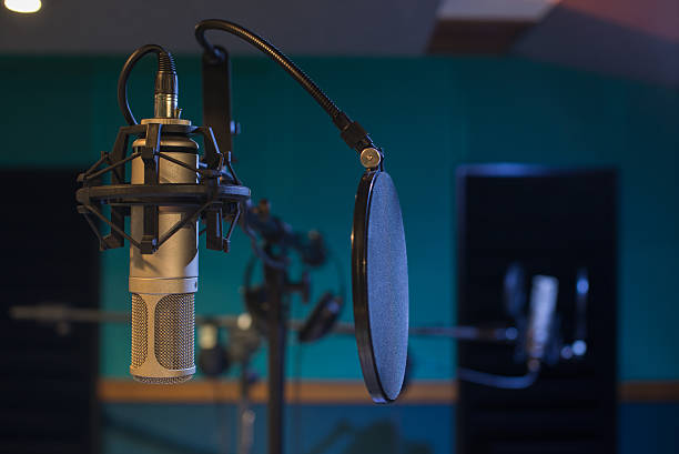 istock music equipment,condenser microphone on recording room 541985698