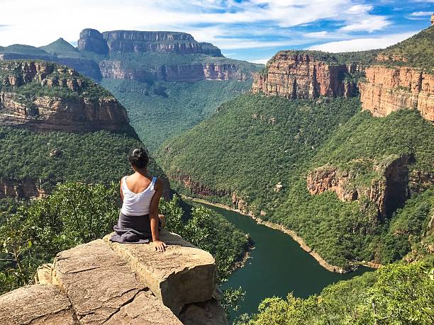 istock Girl looking at a canyon 541986898