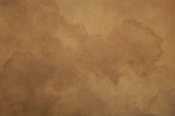 istock Old vintage brown paper parchment background 541987788