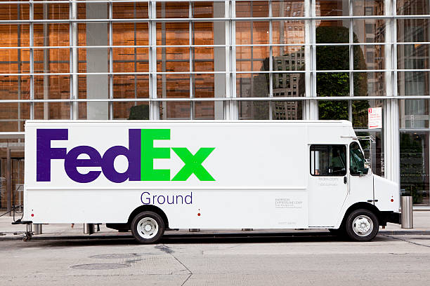 FedEX New York, NY, USA - June 21, 2016: FedEx truck in Manhattan: Fedex is one of largest package delivery companies worldwide with 300,000 employees USD 42.7 billion revenue.  park designer label stock pictures, royalty-free photos & images