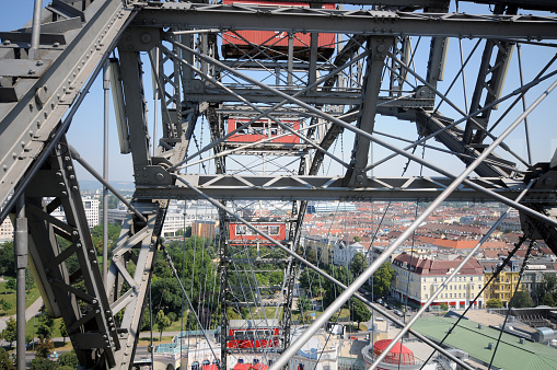 Vienna, Austria - July 18, 2013: Part of the famous Vienna Ferris Wheel with Part of the Skyline. The Image was recorded from a Cabine of the Ferris Wheel in Summer.