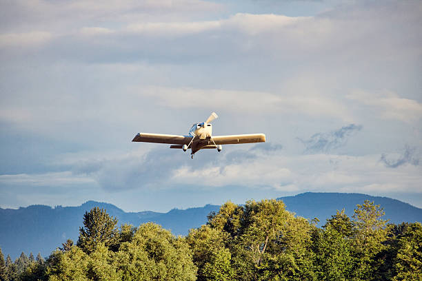 istock Small airplane just after takeoff from an airport. 541989210