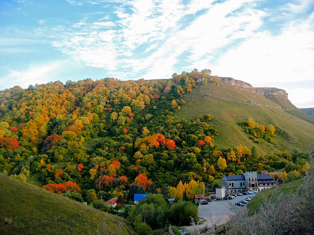 istock Golden autumn, blue sky and caucasus mountains 541989252
