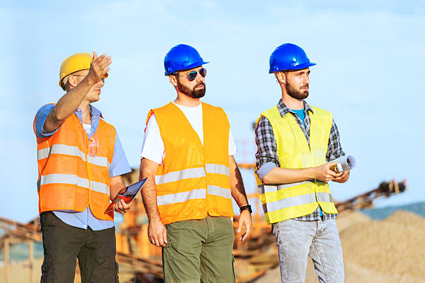 istock Engineers at construction discussing future investments 541989336