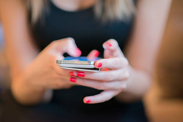 istock Texting on a smartphone. Shallow depth of field. 541990914
