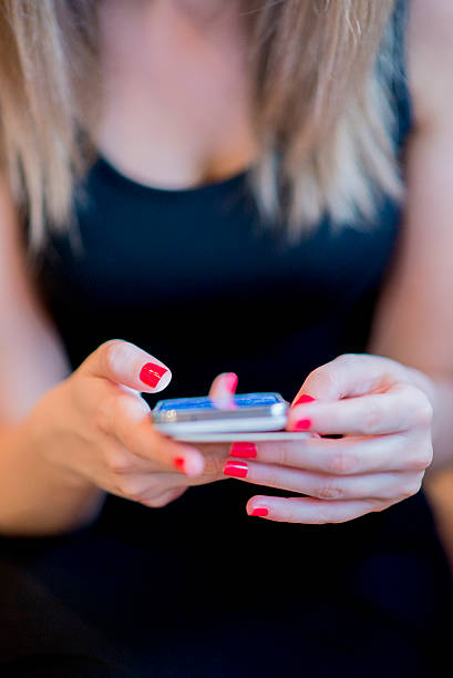 istock woman texting on a smartphone at her home 541991266