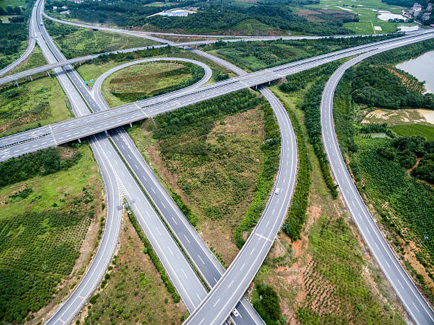 istock Aerial view of intersecting highways near trees 541992462