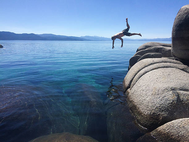 istock Man jumping wildly into Lake Tahoe 541993444