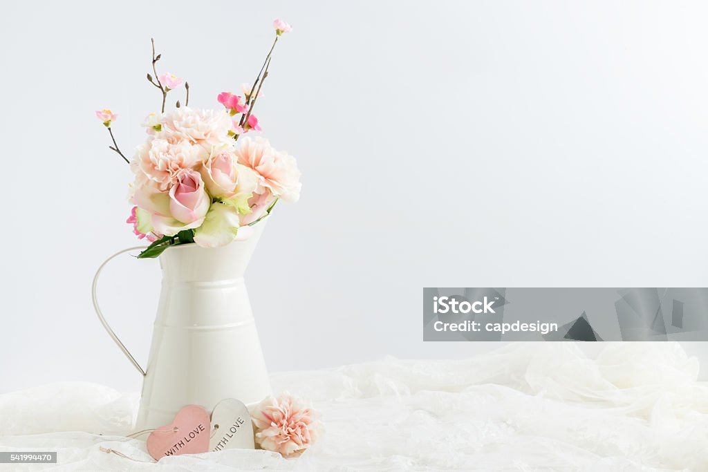 styled stock image of flowers in a cream jug Mockup styled stock image of carnations and roses in a cream jug with a piece of lace. You can place your business promotion, blog title, quote, headline or image in the space beside the jug. Blossom Stock Photo