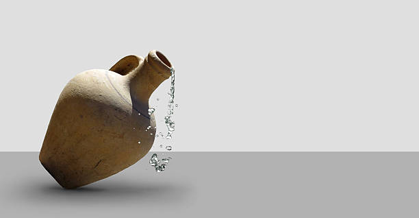 Glinnyany tilted pitcher of water flowing out of it.